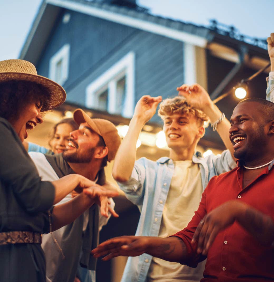 Friends dance in the backyard