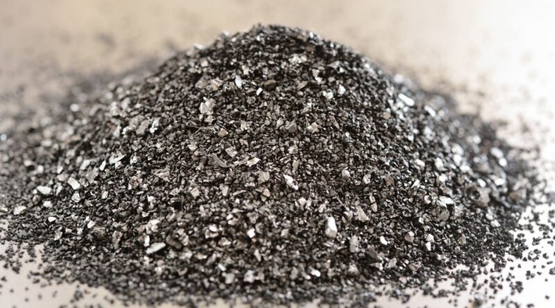 A pile of tiny bits of charcoal